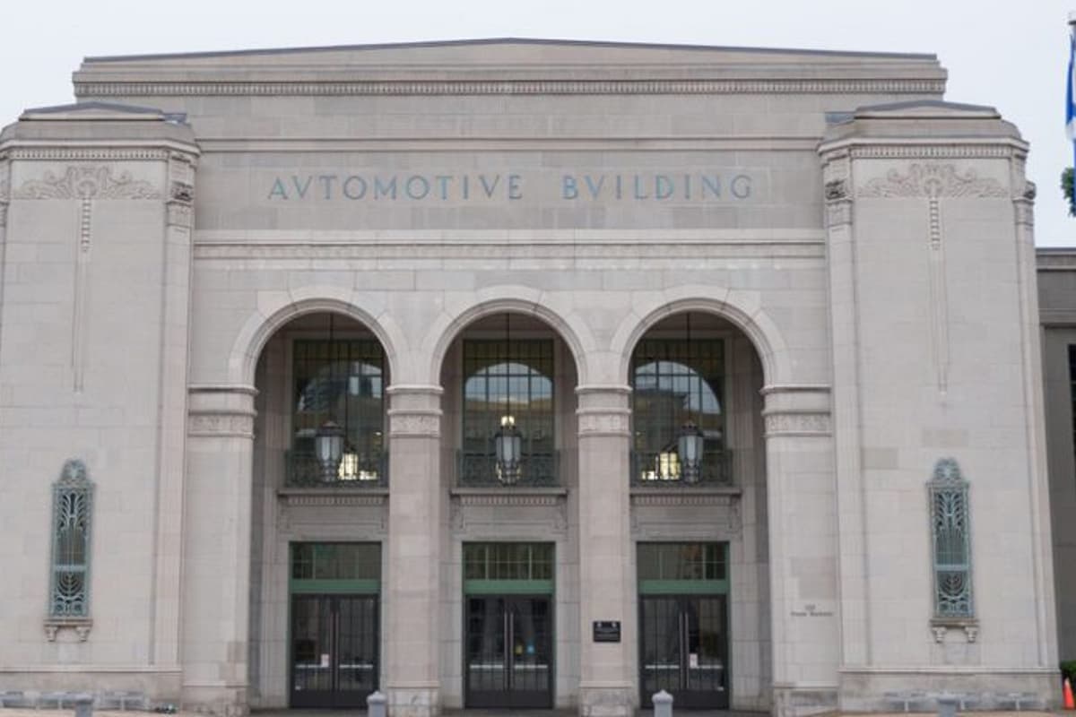 Exterior image of historic Automotive building with columns and archways