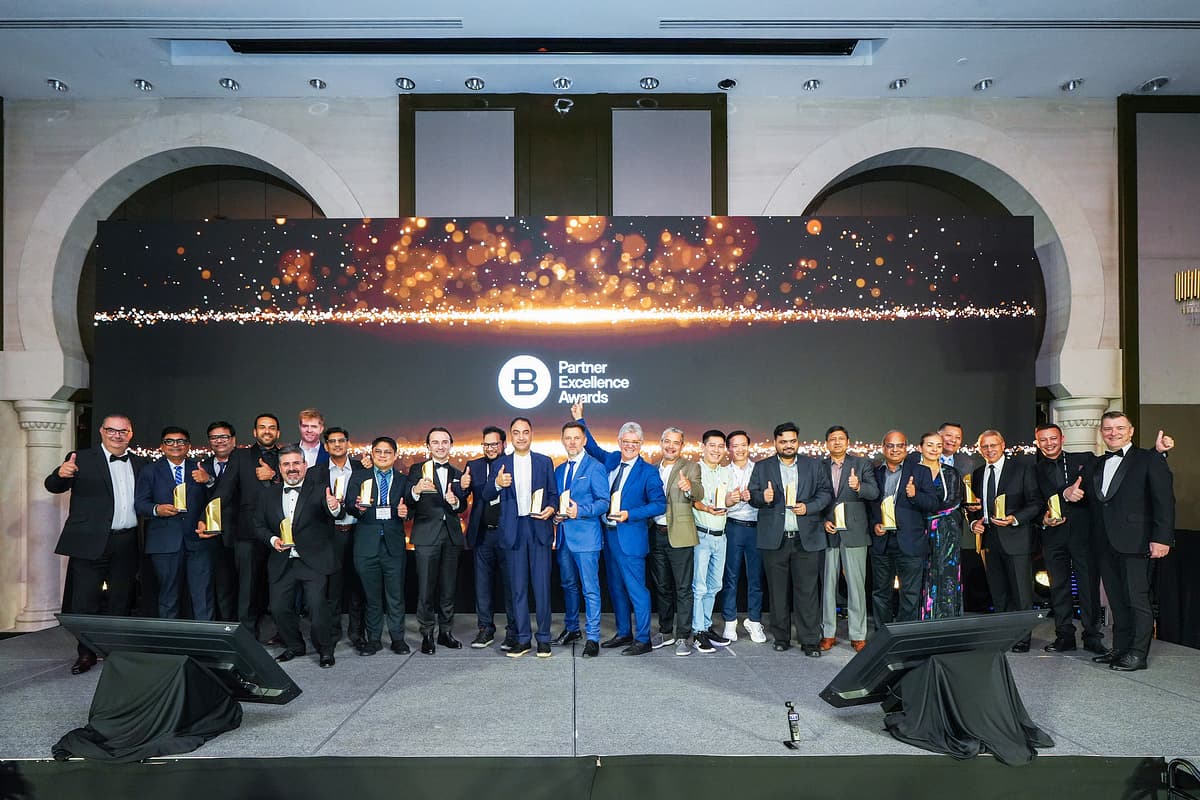 Group photo of people in business attire at awards summit