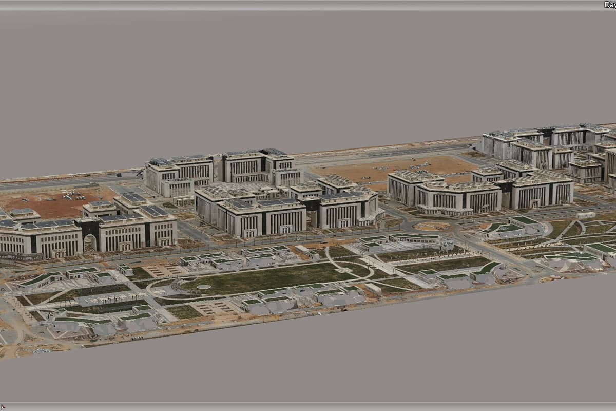 Aerial 3D rendering of a sprawling modern campus with clustered buildings, landscaped courtyards, roads, and parking areas in a muted setting.