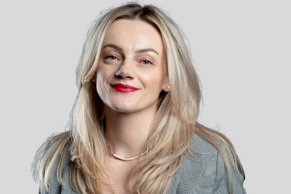 Woman with long blonde hair, smiling