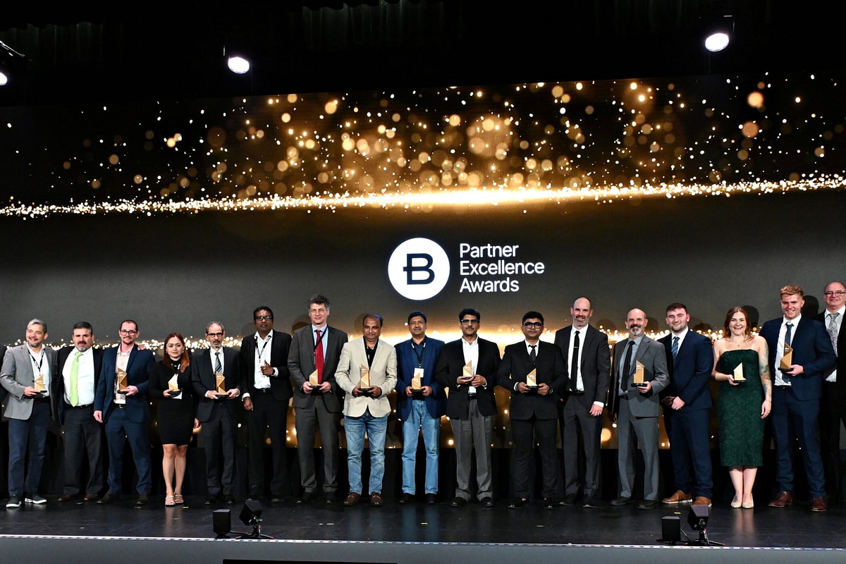 Group photo of people in business attire at awards summit