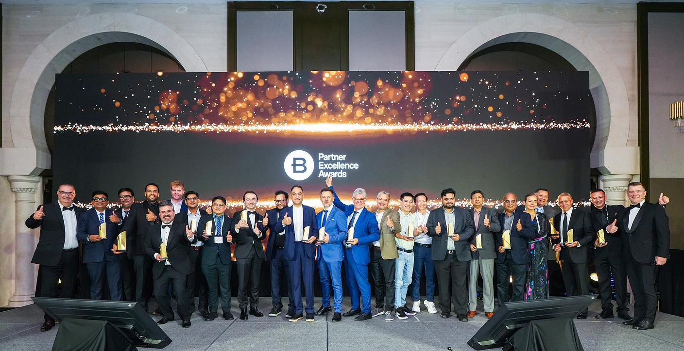 Group photo of people in business attire at awards summit