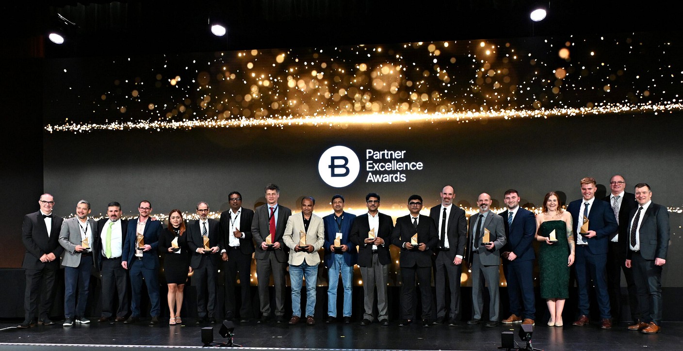 Group photo of people in business attire at awards summit