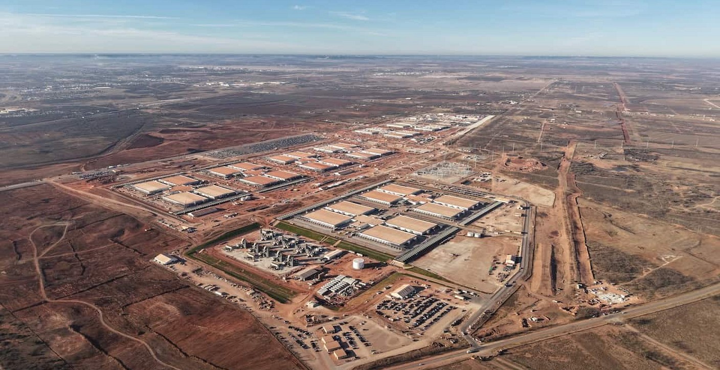 High-angle aerial view of a modern data center campus, demonstrating advanced technological infrastructure, secure digital operations, and efficient facilities site planning.