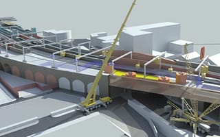 4D construction model in SYNCHRO showing cranes installing a new bridge section over a railway