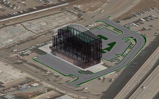 A 3D conceptual site model of a commercial development featuring parking lot layouts, building pads, and grading visualization in OpenSite Designer.