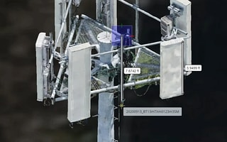 An intelligent digital twin of a communication tower in OpenTower iQ, showing automated measurements and asset identification.