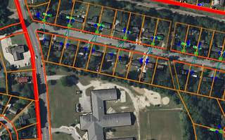 Utility network design and asset management within a residential area shown in OpenUtilities Designer.