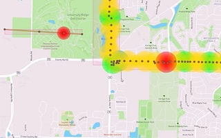 A screenshot of the PLS-Grid software displaying a heat map of a power line on a geographical map. The heat map uses green, yellow, and red to show the status of the line as it passes over streets and parks.