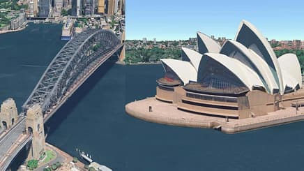 a bridge over water and sydney opera house in daytime
