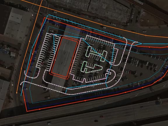 The OpenSite Designer interface displaying automated site grading optimization, earthwork volume comparisons, and stormwater drainage design.