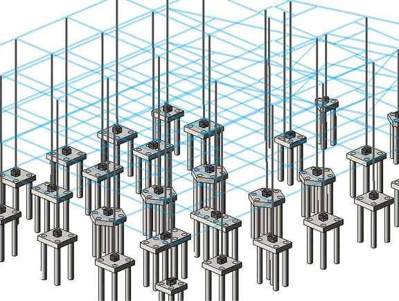 Grid layout of pile caps and deep foundation piles in STAAD Foundation Advanced. A blue wireframe building column grid aligns with concrete pile foundations for structural soil-structure interaction analysis.