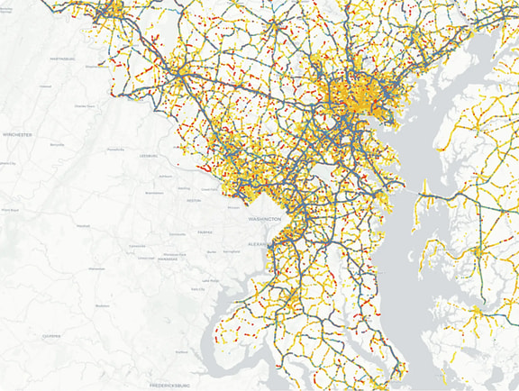 Blyncsy GIS map of the Baltimore-Washington metropolitan area showing a dense, color-coded road network highlighting real-time roadway maintenance and asset condition data points.