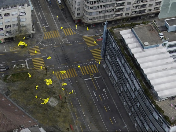 Aerial reality mesh of an urban street intersection in iTwin Capture Modeler, featuring yellow vector overlays for municipal object detection and spatial asset marking.