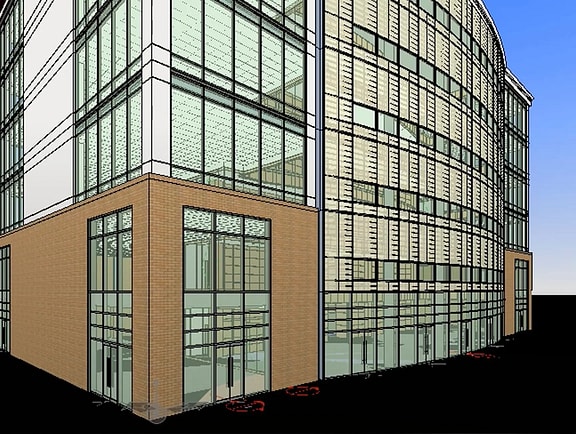 Detailed architectural 3D building model in OpenBuildings Designer, showing a modern glass curtain wall facade, structural framing, and a brick base corner.