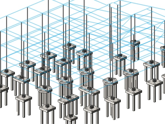 Grid layout of pile caps and deep foundation piles in STAAD Foundation Advanced. A blue wireframe building column grid aligns with concrete pile foundations for structural soil-structure interaction analysis.