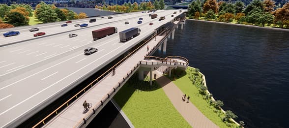 Aerial view of two parallel highways with trucks traveling in opposite directions