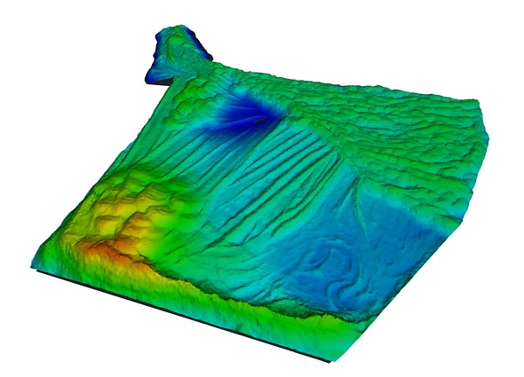 Bentley Descartes 3D digital elevation model (DEM) showcasing color-coded terrain elevations from low blue to high red, highlighting terrain contours, slopes, and landforms.