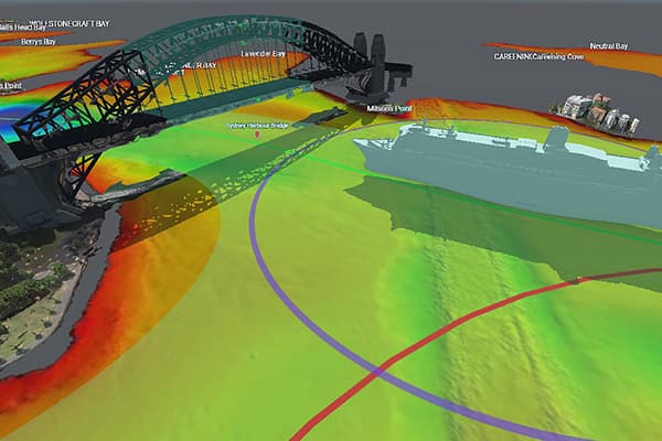 3D flood-risk map of a large arched bridge over a river, with vivid green, yellow, red, and blue zones showing changing water levels.
