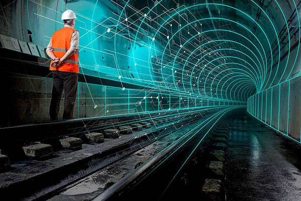 Digital twin graphic showing person in construction clothes near rail track