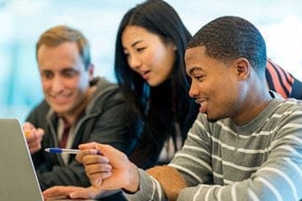 Students interact in college classroom