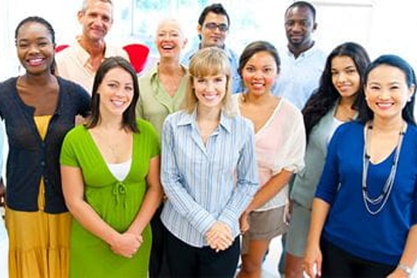 Diverse group of men and women smiling