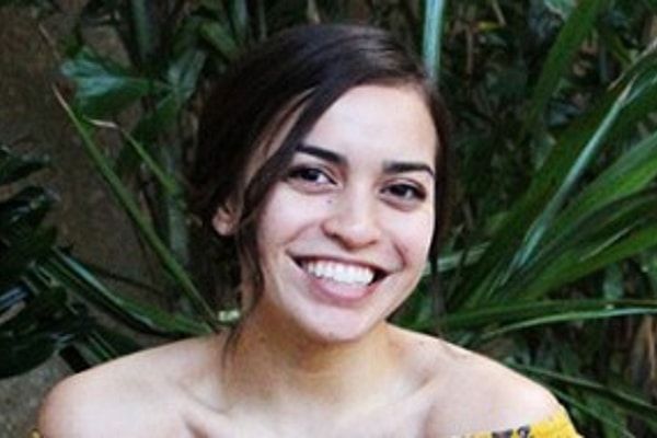 Woman with dark hair smiling