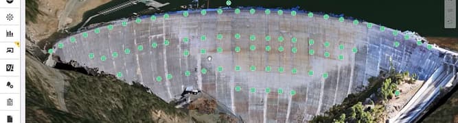 A screenshot of the iTwin IoT platform displaying a 3D digital twin of the New Bullards Bar Dam, with green dots indicating the locations of 83 real-time monitoring sensors.