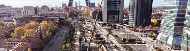 An aerial view of the major urban redevelopment and underground infrastructure construction along Paseo de la Castellana in downtown Madrid, Spain.