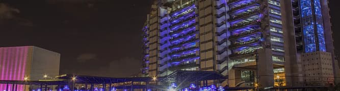 The headquarters of Empresas Públicas de Medellín (EPM) at night, the utility that undertook a major project to modernize the wastewater network in the Aburrá Valley.