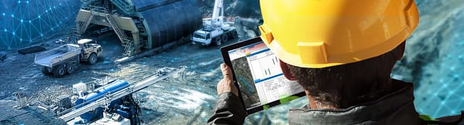 A drilling engineer from Jackson Drilling using OpenGround on a tablet for on-site digital data collection, which helps reduce time and eliminate transcription errors from paper logs.