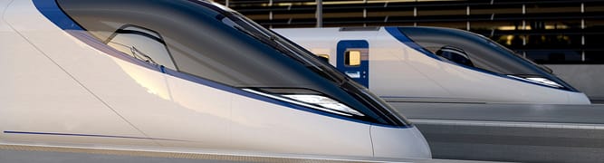  Two HS2 high-speed trains at a platform, the visible outcome of a massive infrastructure project where Mott MacDonald used Leapfrog Works to manage complex earthworks and material reuse.