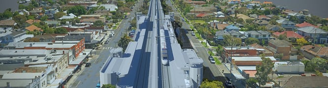 Digital twin of the Parkdale Level Crossing Removal Project, showing WSP's design for the new elevated rail bridge and station integrated within the existing urban landscape. 
