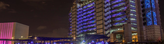 The headquarters of Empresas Públicas de Medellín (EPM) at night, the utility that undertook a major project to modernize the wastewater network in the Aburrá Valley.