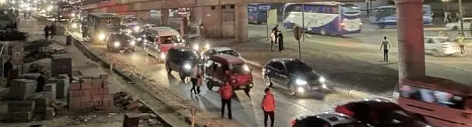 Nighttime photo showing heavy traffic congestion on a street in Cairo, representing the mobility challenges that were analyzed for the Cairo Metro Line 4 project.