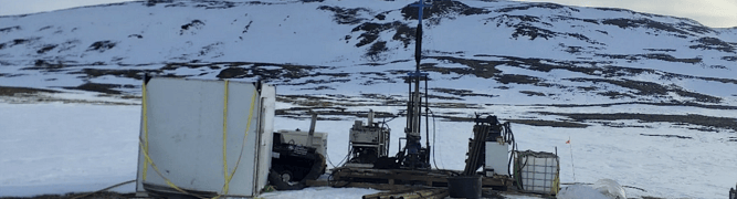 A drilling rig active during a winter geotechnical borehole investigation in a snowy landscape.