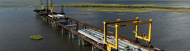 An aerial view of the Leeville to Golden Meadow Bridge under construction across the Louisiana wetlands.