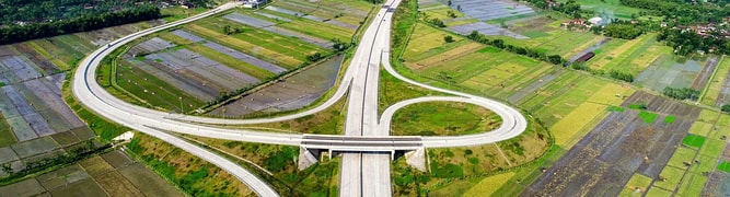 An aerial view of a major interchange on the Sumatran Expressway, where PT. Hutama Karya used digital geotechnical analysis to save 120 days and prevent huge losses on the project.