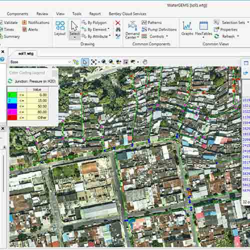 A computer screen displays a WaterGEMS interface with a satellite map showing a water distribution network and colored nodes indicating pressure levels, highlighting the power of managing water resources for our planet.