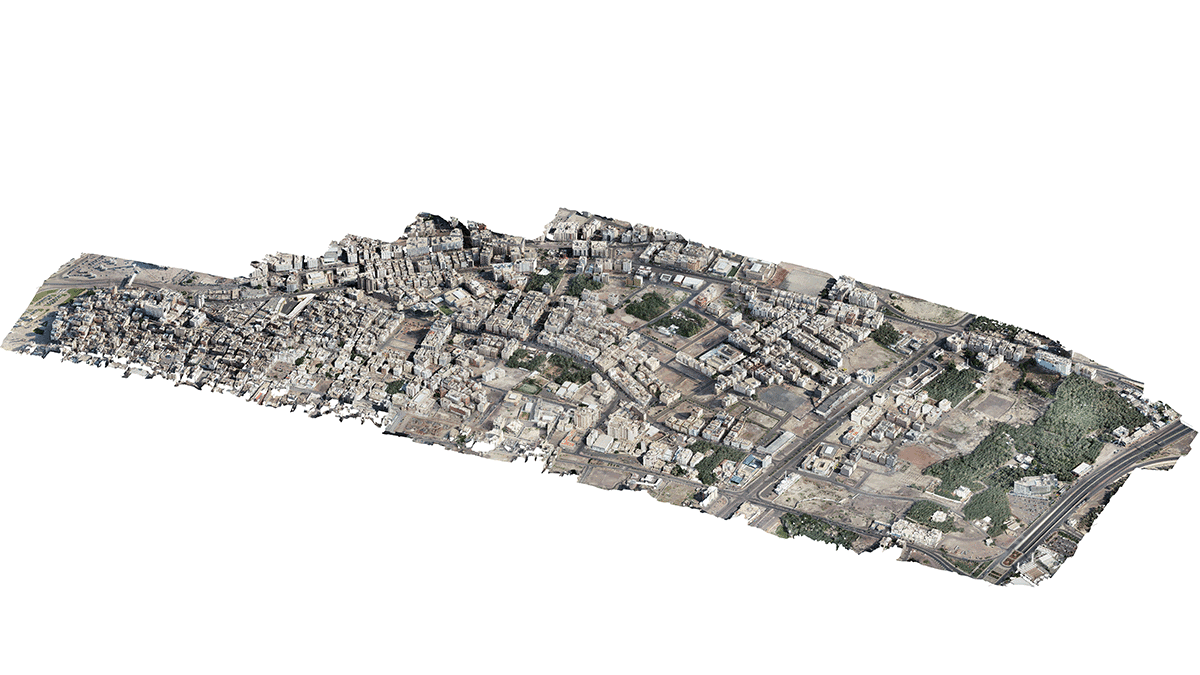Aerial 3D model of an urban area in the Madinah smart city, showing buildings, streets, and green spaces, isolated on a white background.