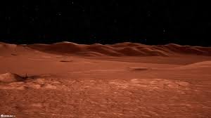 A barren, reddish landscape with dunes under a dark sky, resembling the surface of Mars.