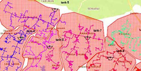 A color-coded map with segmented areas outlined and labeled, displaying various interconnected routes and marked points labeled as tank within the sections, ideal for visualizing water system optimization or water hydraulics modeling.