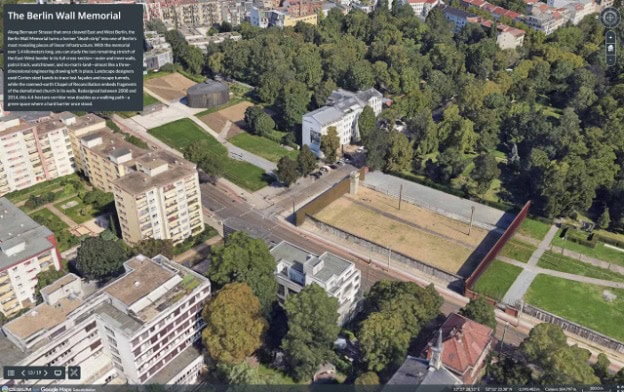 Luftaufnahme der Gedenkstätte Berliner Mauer mit erhaltenen Mauerabschnitten, umliegenden Gebäuden, Grünflächen und Informationstafeln in einer städtischen Parkanlage.