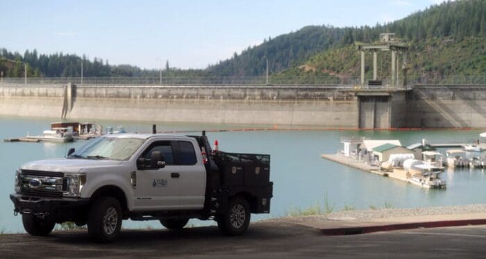 Truck in front of water