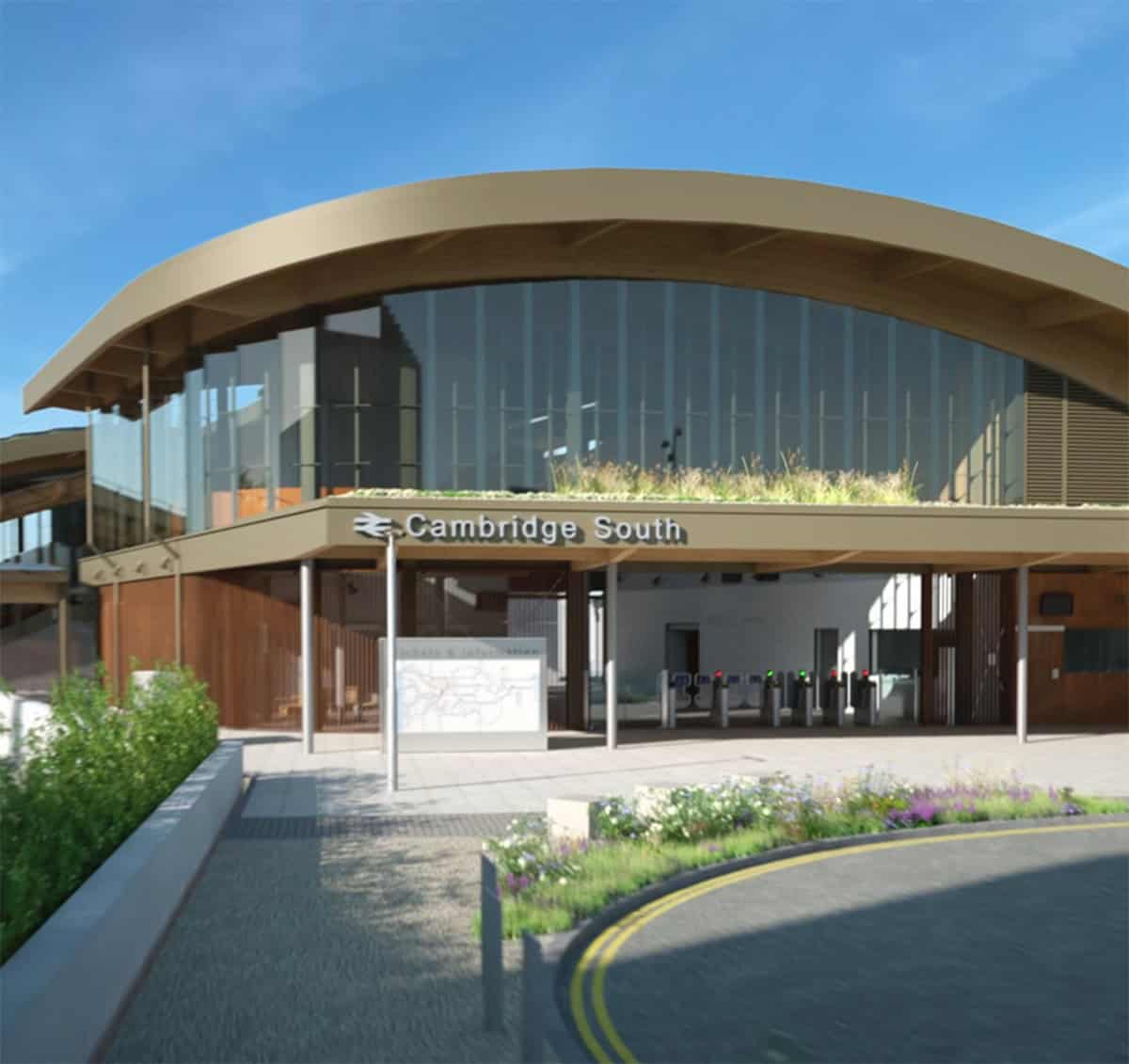 Modern building with curved roof and glass facade labeled Cambridge South, featuring a landscaped entrance&mdash;an example of engineering clarity from the Arcadis Rail Division&mdash;with visible ticket barriers under a clear blue sky.