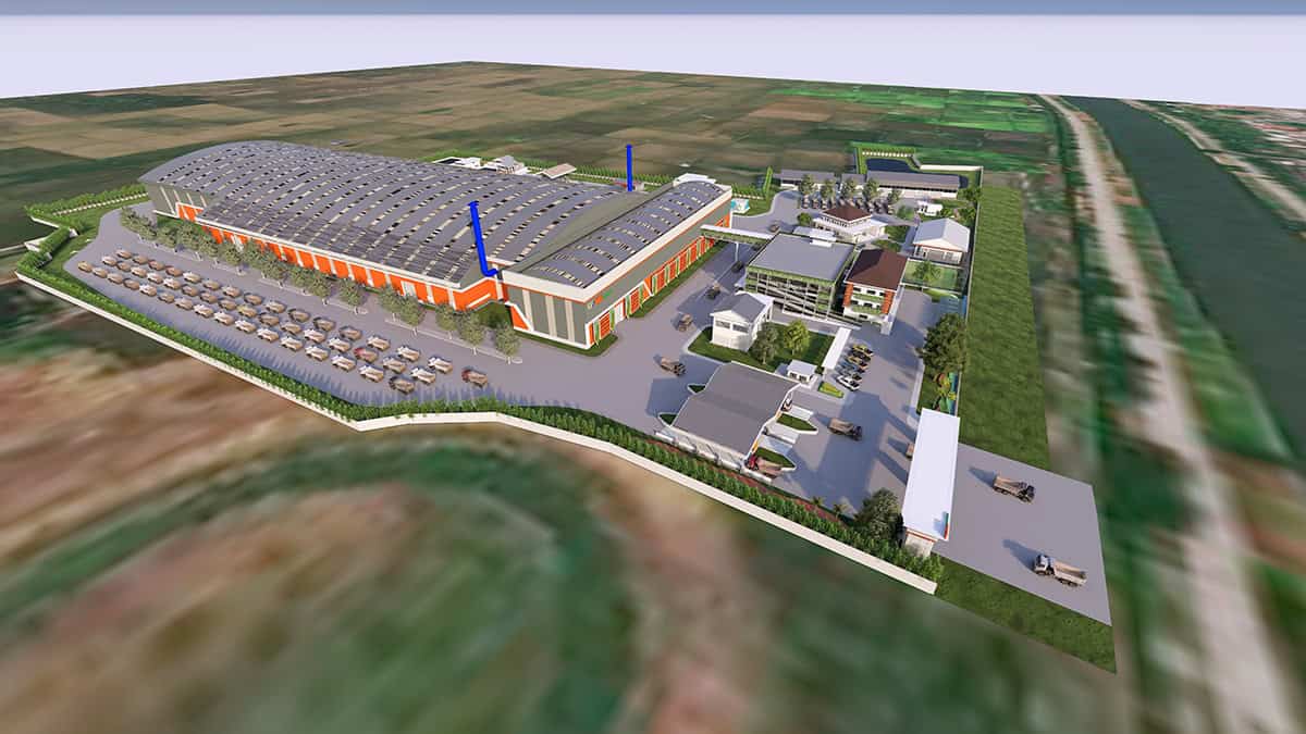 Aerial view of the PT Wijaya Karya YII Project industrial facility, showcasing a large warehouse, several smaller buildings, parked cars, and surrounding greenery near fields and a canal, supporting refuse-derived fuel operations.