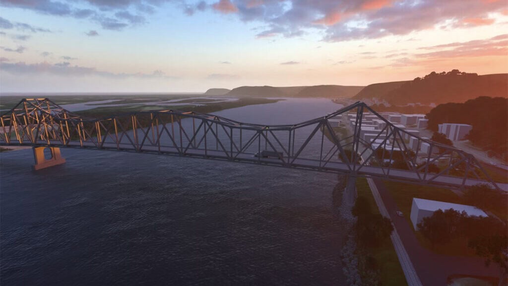 A truss bridge showcasing innovative bridge design spans a wide river at sunset, with a vehicle crossing and hills, buildings, and water visible in the background.