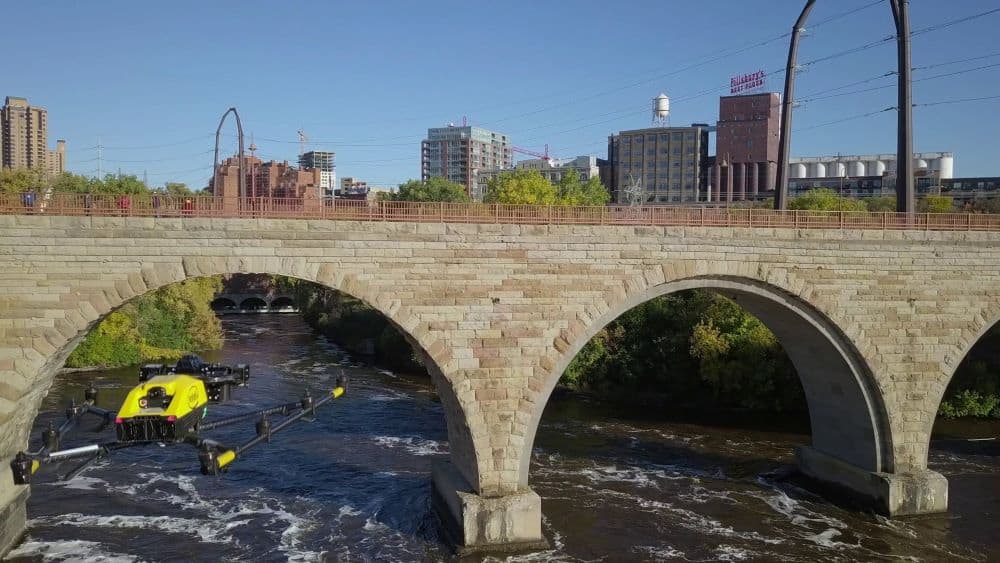 Drone flying near bridge