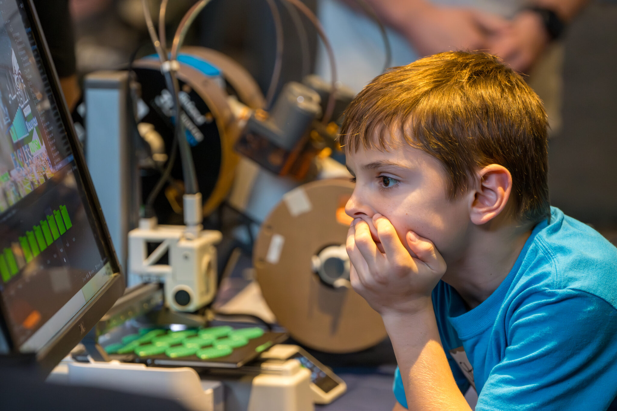 An attendee trying out the 3D printing station.