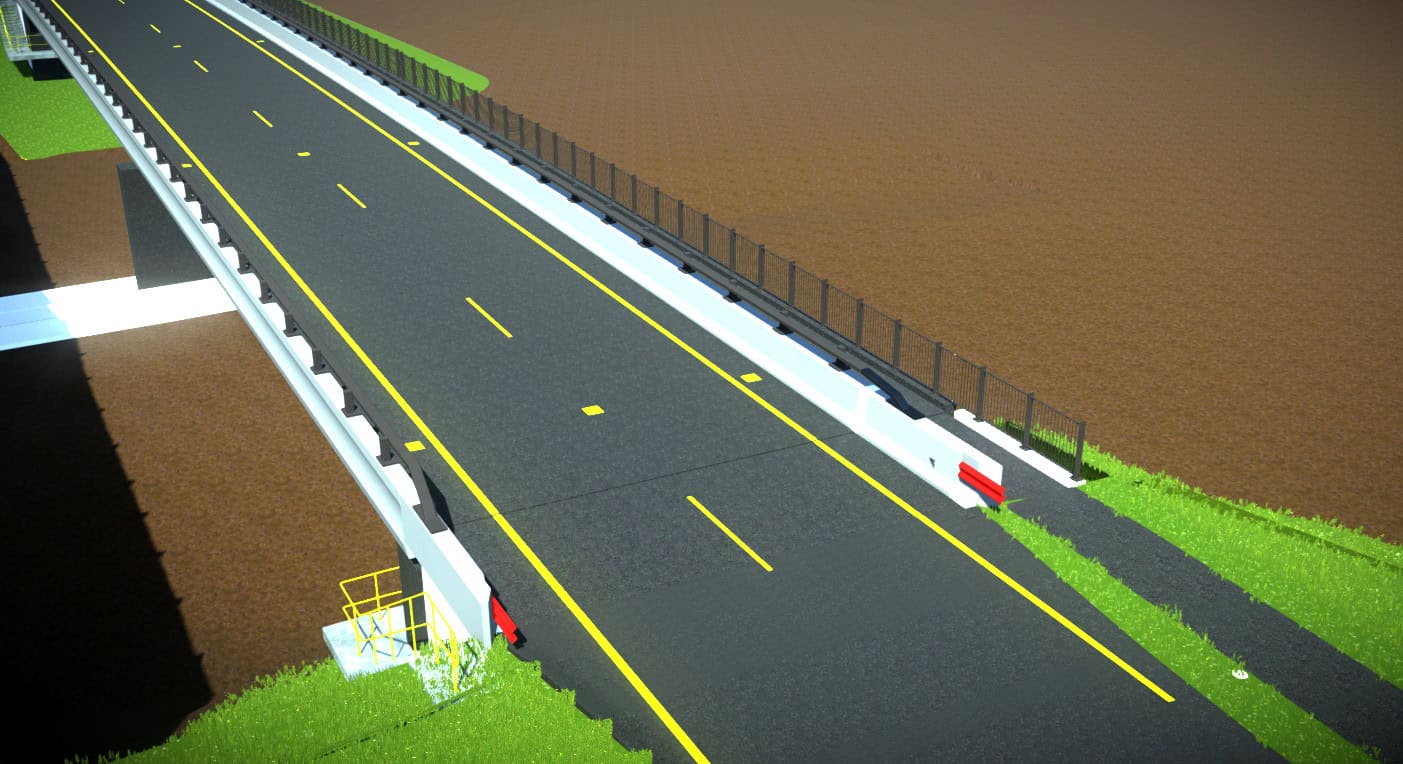A straight, elevated road with yellow lines and side barriers. The road is flanked by green grass on one side and a brown field on the other.